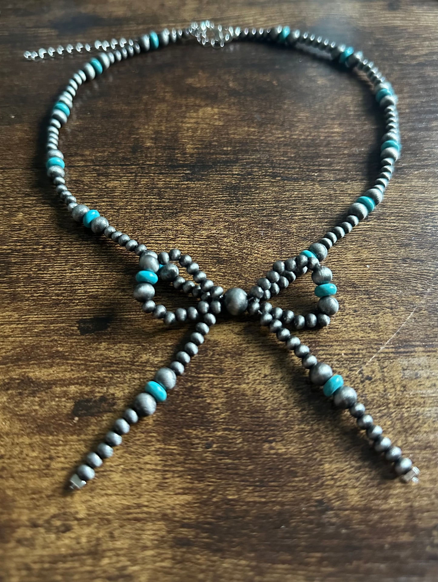 Faux pearl bow necklace