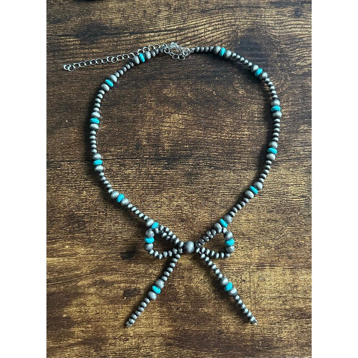 Faux pearl bow necklace